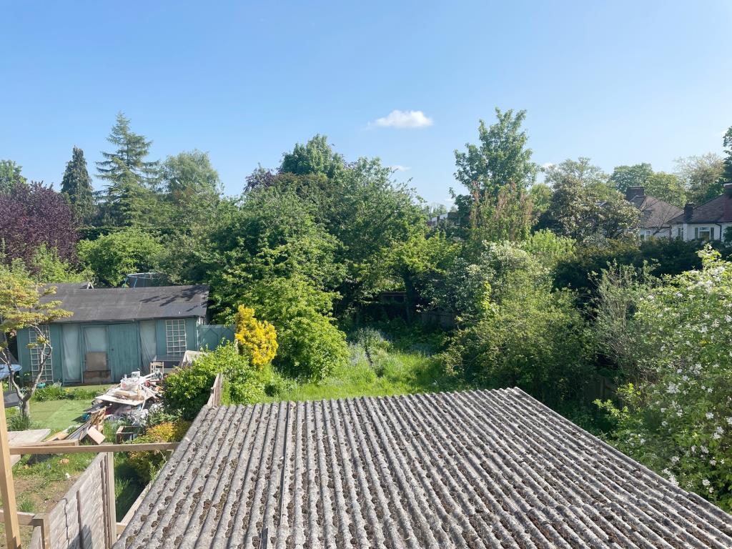 Lot: 26 - FOUR-BEDROOM SEMI-DETACHED HOUSE FOR IMPROVEMENT - View of the rear garden from the first floor bedroom window